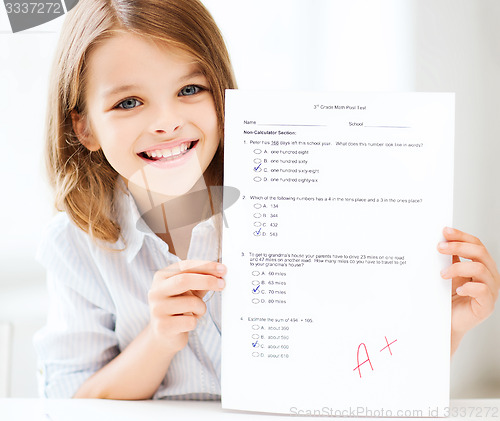 Image of girl with test and grade at school