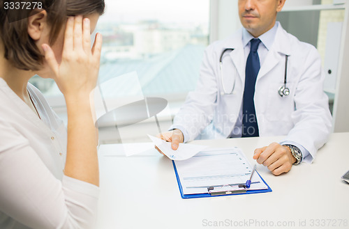 Image of close up of doctor and woman meeting at hospital