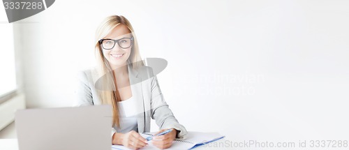 Image of businesswoman with documents