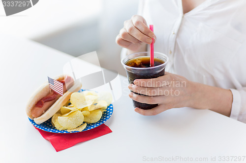 Image of close up of woman drinking coca cola