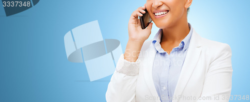 Image of african businesswoman calling on smart phone