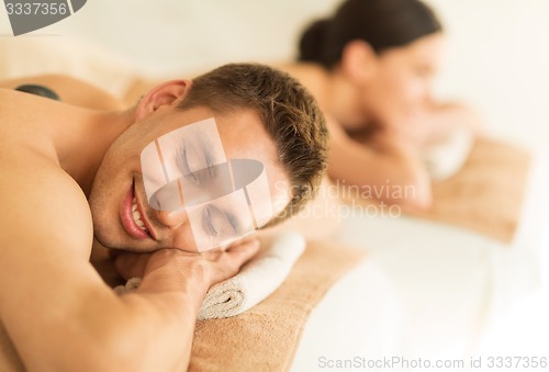 Image of couple in spa with hot stones