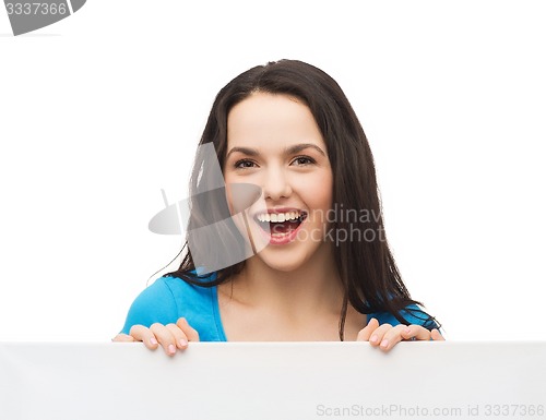 Image of smiling young girl with blank white board