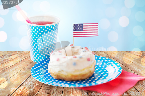 Image of donut with juice and american flag decoration