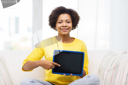 Image of happy african american woman with tablet pc