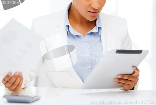 Image of businesswoman with tablet pc in office