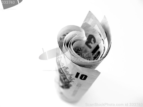 Image of money rolled on white background