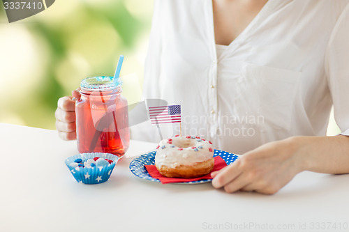 Image of woman celebrating american independence day