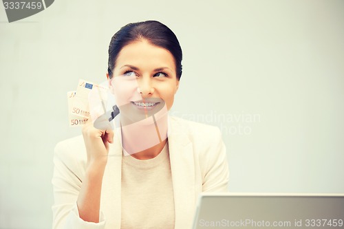 Image of lovely woman with euro cash money