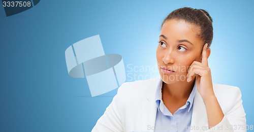 Image of african businesswoman looking up and thinking
