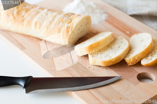 Image of close up of white bread or baguette and knife