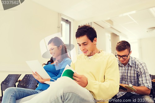 Image of group of smiling students in lecture hall