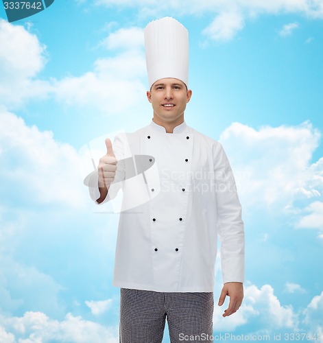 Image of happy male chef cook showing thumbs up