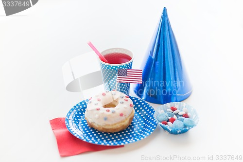Image of donut with juice and candies on independence day