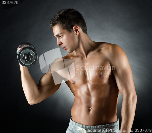 Image of young man with dumbbell