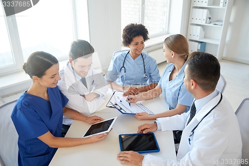 Image of group of happy doctors meeting at hospital office