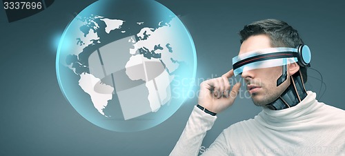 Image of man with futuristic 3d glasses and sensors