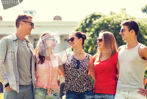 Image of group of smiling friends outdoors