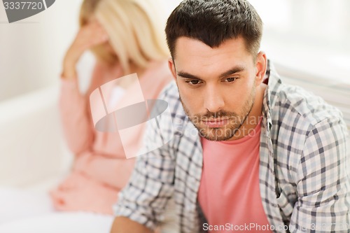 Image of unhappy couple having argument at home