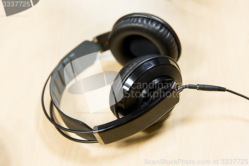 Image of headphones at recording studio or radio station