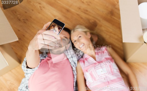 Image of couple with big cardboard boxes moving to new home