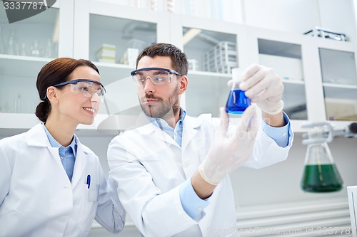 Image of young scientists making test or research in lab