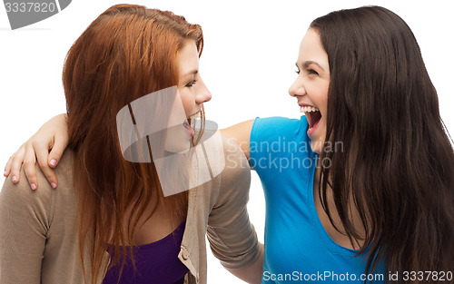 Image of two laughing girls looking at each other