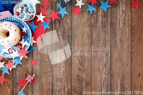 Image of donut with candies and stars on independence day