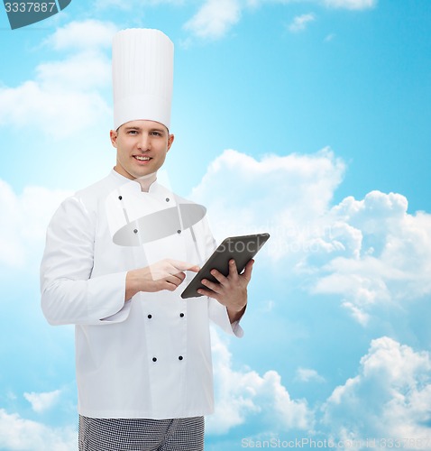 Image of happy male chef cook holding tablet pc