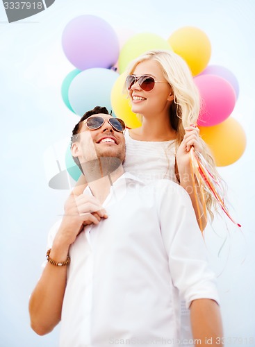 Image of couple with colorful balloons