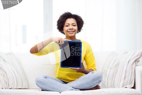 Image of happy african american woman with tablet pc