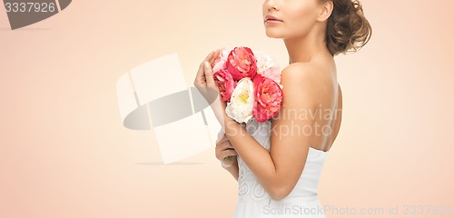 Image of bride or woman with bouquet of flowers