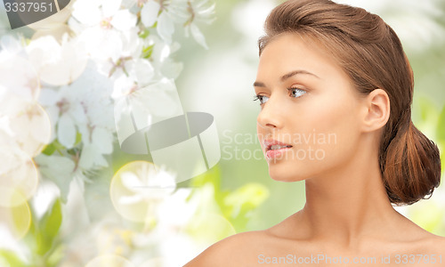 Image of beautiful young woman face looking aside