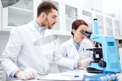 Image of young scientists making test or research in lab