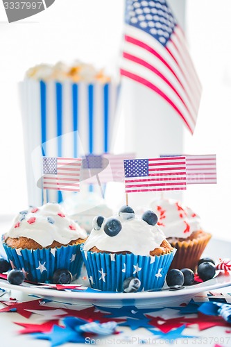 Image of cupcakes with american flags on independence day