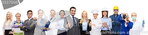 Image of happy businessman over professional workers