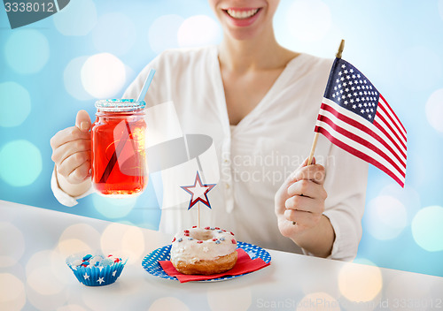 Image of happy woman celebrating american independence day