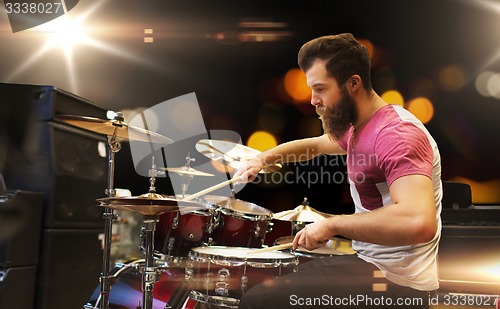 Image of male musician playing cymbals at music concert