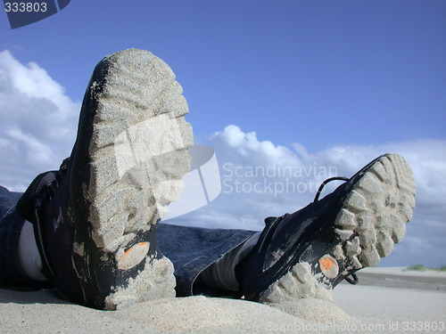 Image of shoes on mud