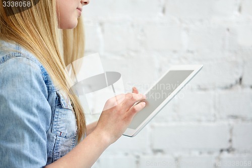 Image of close up of female hands with tablet pc on stairs