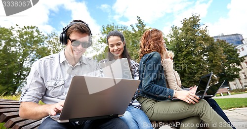 Image of students or teenagers with laptop computers