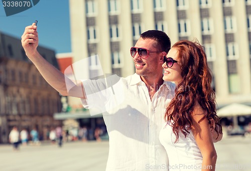 Image of smiling couple in city