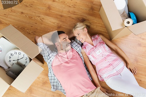 Image of couple with big cardboard boxes moving to new home