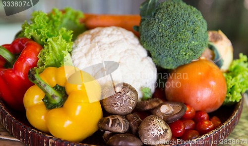 Image of basket of fresh ripe vegetables at kitchen