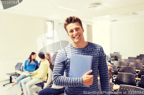 Image of group of smiling students in lecture hall