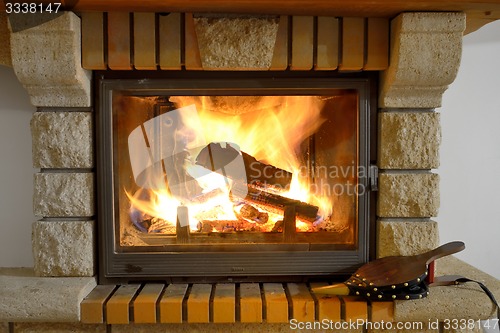 Image of burning wood in fireplace