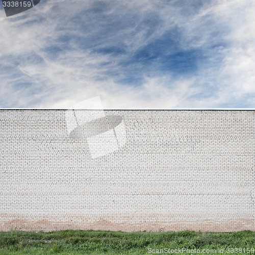 Image of Blue sky with clouds behind the huge wall