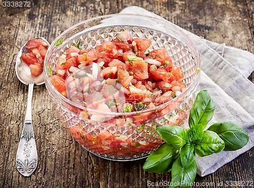 Image of chopped tomatoes with onions and basil