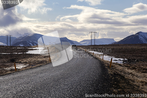 Image of Snowy volcano landscape with dramatic clouds in Iceland