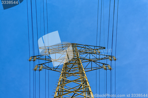 Image of Large electric pylon with blue sky